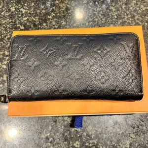 black zippy Louis Vuitton wallet